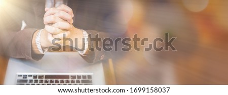A man praying by faith with computer laptop ,Church services online concept, Online church at home concept, spirituality and religion. Royalty-Free Stock Photo #1699158037