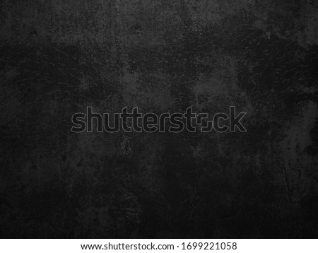 Dark concrete texture wall background. Black grunge cement wall texture for interior design. Copy space for add text. Royalty-Free Stock Photo #1699221058