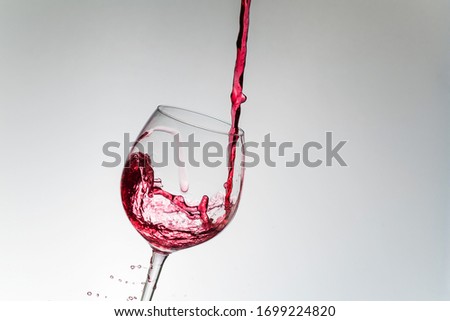 Glass of red wine with bubble