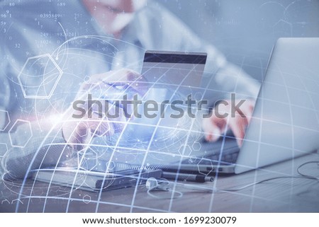 Double exposure of man hands holding a credit card and world map drawing. International Internet E-commerce and technology concept.