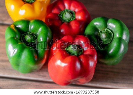 Colorful bell pepper on a wood boards