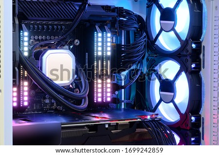 Close-up and inside high performance Desktop PC and Cooling system on CPU socket with multicolored LED RGB light show status on working, interior on Computer PC Case and DIY, technology background Royalty-Free Stock Photo #1699242859