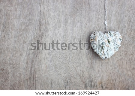 hearts shapes with wool texture over wooden background 