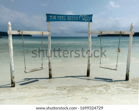 Wooden entrance to the sea and two wooden swings. Kog Rong, Cambodia