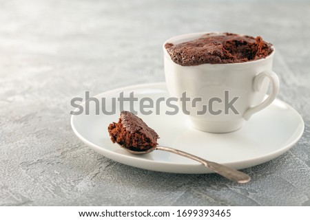Chocolate cupcake in a white mug. Easy homemade dessert. Mugcake Royalty-Free Stock Photo #1699393465