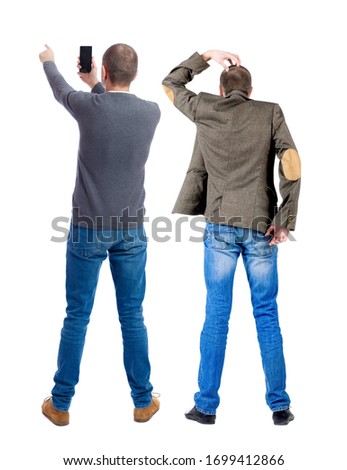 Back view of two man in sweater with mobile phone. Rear view people collection. backside view of person. Isolated over white background.