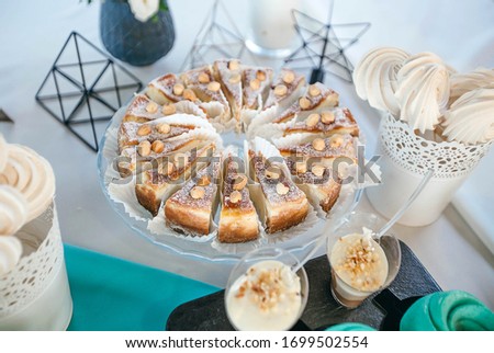almond pie, cut into portions on a glass plate