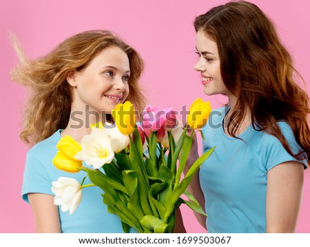 Merry mom and daughter flowers decoration joy pink background