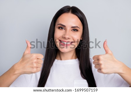 Close-up portrait of her she nice-looking attractive lovely pretty cute cheerful cheery glad straight-haired girl showing double thumbup isolated over light grey pastel color background