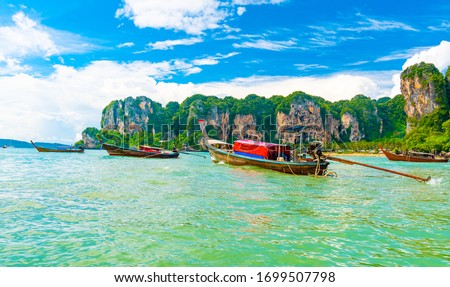 View from boat going to famous Railay beach in Krabi town, Thailand. Favorite place in Thailand with pure sea, white sand and beautiful limestone rocks. Vacation target in tropical paradise. Royalty-Free Stock Photo #1699507798