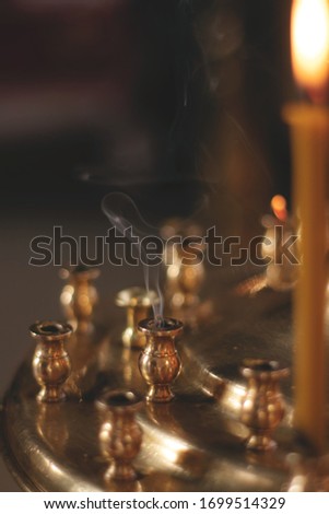A close up of smoke in a candlestick 