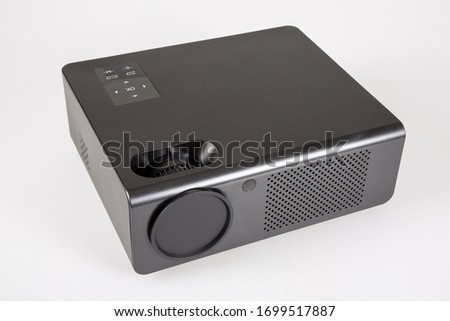 Generic multimedia black modern projector isolated on white background