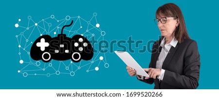 Woman using digital tablet with online gaming concept on background