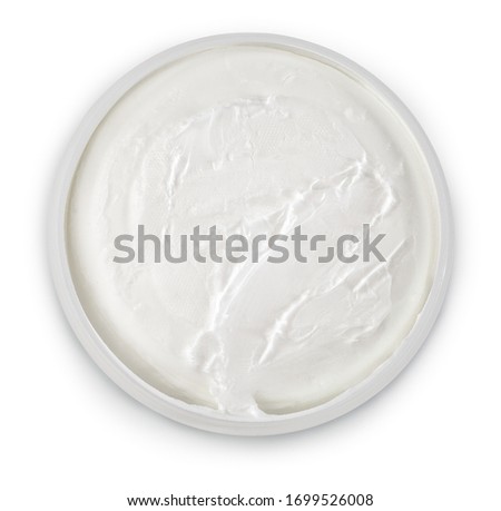 Hydratating cosmetic creme for face, body and hands. Top view. Isolated on white background with natural shadow. With clipping path. Natural cosmetic skin cream. Hand repair care creme. Royalty-Free Stock Photo #1699526008