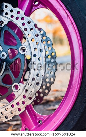 brake disc and motorcycle wheel with blurry background