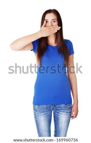Beautiful woman having her hand on mouth. Isoalted on white.