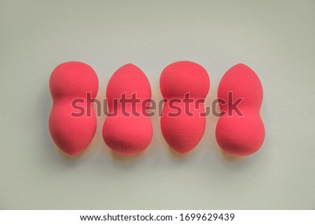 pink beauty blenders on a white background