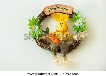 Welcome sign with flowers and Easter bunny
