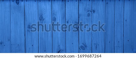 The old blue wood texture with natural patterns. classic blue background
