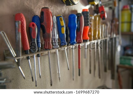 Hanging screwdrivers of various sizes
