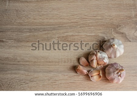garlic close-up on a wooden background in the corner of the picture