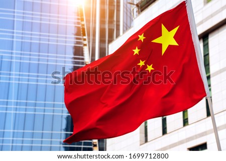 Chinese flag against Business Buildings