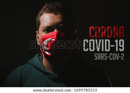 Man with mask with Turkish flag for protection of corona virus covid-19 SARS-CoV-2
