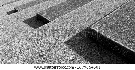 Abstract stairs in black and white, abstract steps, stairs in the city, granite stairs, often stone stairs seen on monuments and landmarks(Black and white photo)