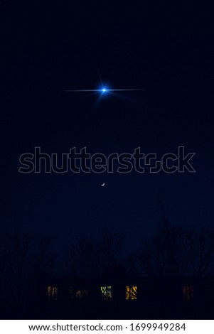Night dark blue sky with a star and Moon. City landscape.