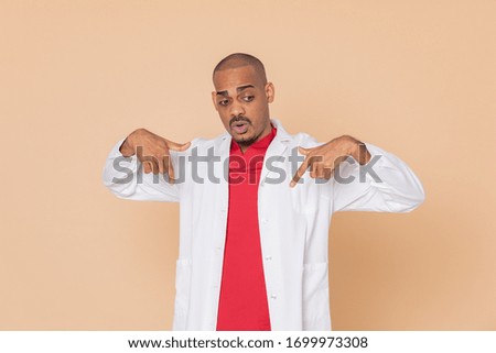 African doctor wearing a lab coat on a yellow background