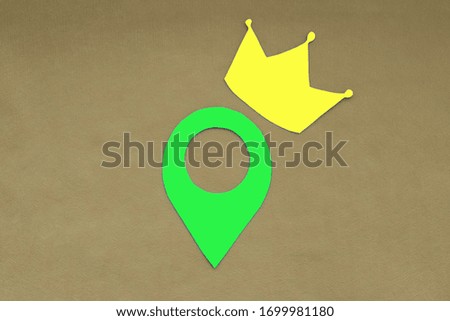 Crown, geolocation sign on a light brown background. Location.