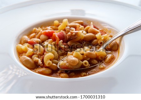Traditional Italian peasant bean soup pasta e fagioli with gluten-free elbow macaroni noodles Royalty-Free Stock Photo #1700031310