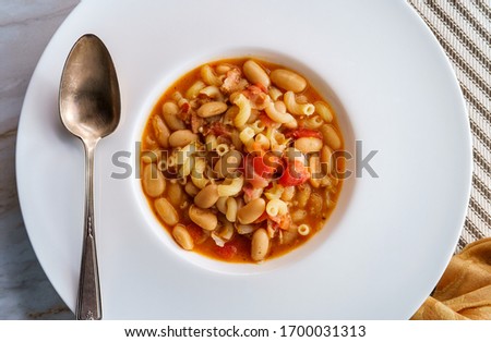 Traditional Italian peasant bean soup pasta e fagioli with gluten-free elbow macaroni noodles Royalty-Free Stock Photo #1700031313