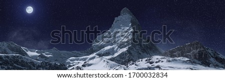 panoramic view to the majestic Matterhorn mountain at night. Valais, Switzerland Royalty-Free Stock Photo #1700032834