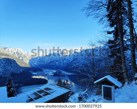Hallstatt, Austria
lake surrounding mountains 
alps