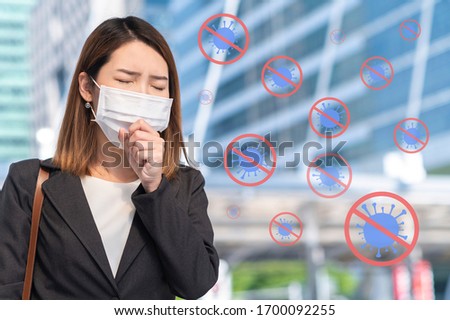 Medical and stop coronavirus or Covid-19 concept, Young woman wearing surgical mask with virus icon surrounds body in public