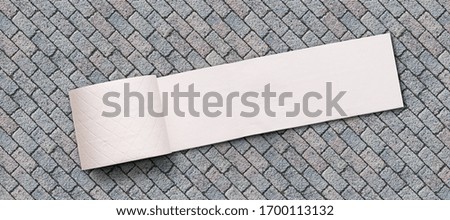 toilet paper on stone background