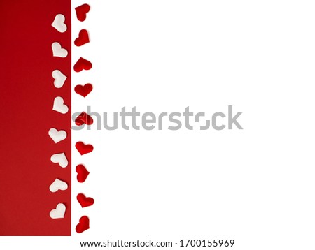many red hearts in a row on a white isolated background. White hearts on a bright red background. Cover, postcard