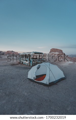 Tent set up in the middle of the desert at dawn