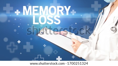doctor writes notes on the clipboard with MEMORY LOSS inscription, first aid concept