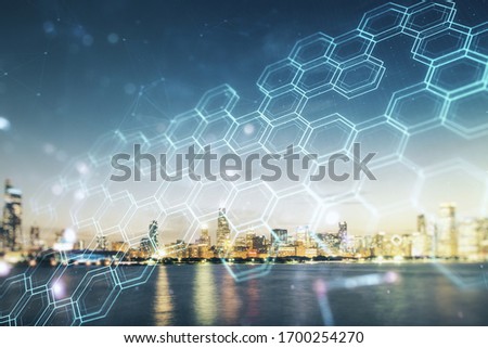 Double exposure of abstract virtual technology hologram with hexagon on Chicago city skyscrapers background. Research and development software concept