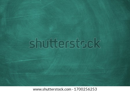 Abstract texture of chalk rubbed out on blackboard or chalkboard background. School education, dark wall backdrop or learning concept.