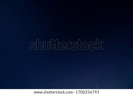 Dark blue sky on a starry night. Wide angle shot on a clear night. Royalty-Free Stock Photo #1700256793