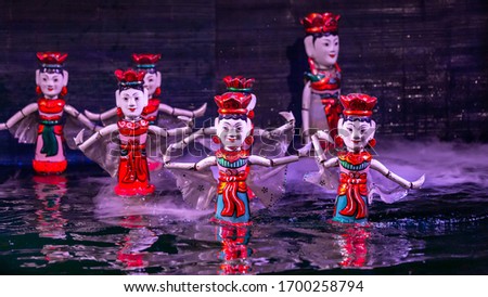 Traditional Vietnamese performance water puppet theatre show in Hanoi, Water puppetry, Hanoi, Vietnam. Royalty-Free Stock Photo #1700258794