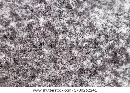 Macro close up shot of a gray cotton textured surface