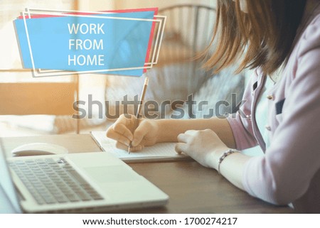 Beautiful smart  young woman working on laptop at home in living room.work from home.selective focus.