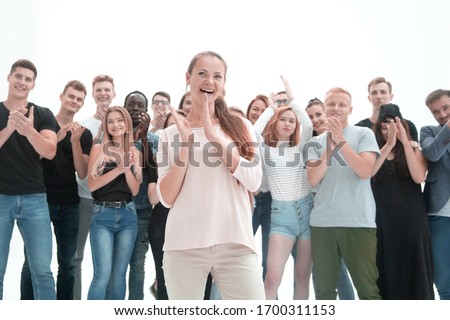 group of diverse young people applauding together
