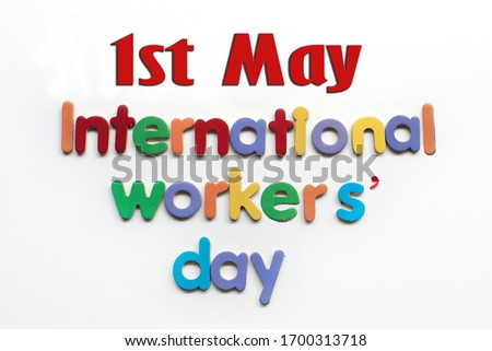 International workers' day text in multi color on white background. Labor day concept sign. International workers' day text written on white background. 1st May