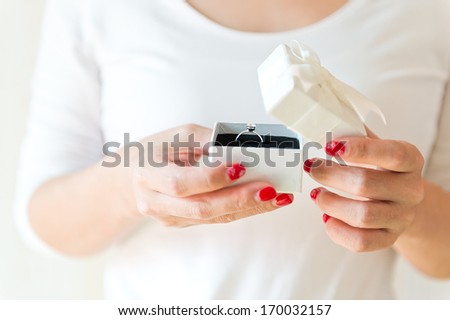 Gift box in woman hands.