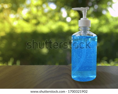 Alcohol gel bottle or hand sanitizer cleaners for anti Bacteria and avoid infections corona virus, Covid-19 on blurred background. Selective focus.